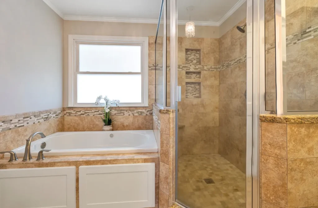 Brown Shower Remodel Oasis Bathroom Boca Raton Modern bathroom featuring a luxurious shower and bathtub, showcasing elegant tile work and natural light, highlighting Oasis Bathroom Remodeling's expertise in shower remodels in Boca Raton.