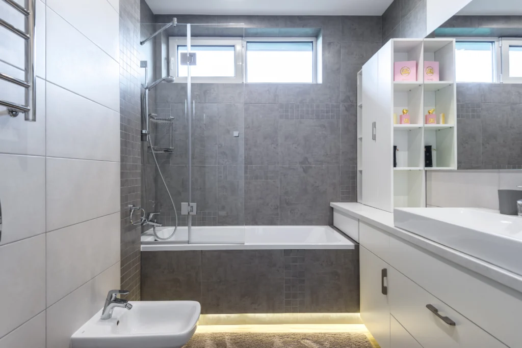 Compact Bathroom Renovation Oasis Bathroom Boca Raton Compact modern bathroom renovation featuring a sleek shower and bathtub combination, contemporary fixtures, and minimalist cabinetry, reflecting Oasis Bathroom Remodeling's design expertise in Boca Raton.