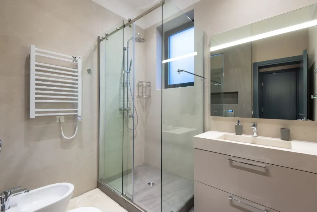 Modern Shower Remodel Oasis Bathroom Boca Raton Modern bathroom shower remodel featuring a glass enclosure, sleek fixtures, and contemporary design elements, emphasizing luxury and functionality for Oasis Bathroom Remodeling Boca Raton services.