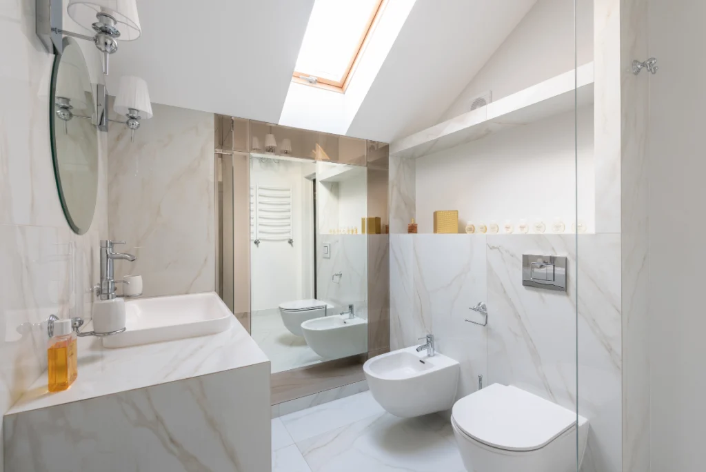 New Bathroom Remodeling Contractors Oasis Bathroom Boca Raton Modern bathroom design featuring a sleek glass-enclosed shower, elegant marble walls, stylish fixtures, and natural light from a skylight, exemplifying high-quality craftsmanship by professional bathroom remodeling contractors in Boca Raton.