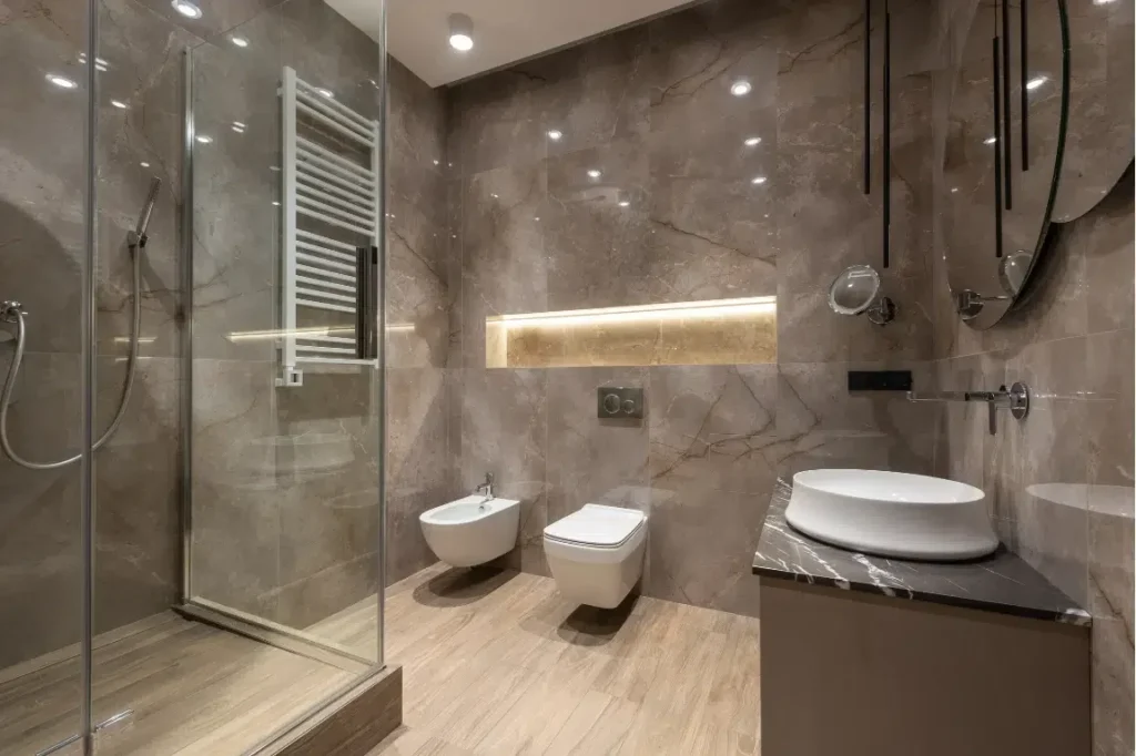 Trending Small Bathroom Oasis Bathroom Boca Raton Modern small bathroom design featuring sleek fixtures, minimalist color scheme, glass shower enclosure, and innovative storage solutions.