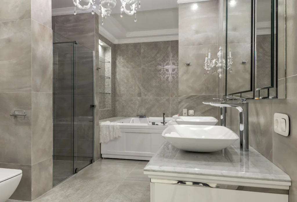 White Bathroom Remodel Oasis Bathroom Boca Raton Modern bathroom featuring a jacuzzi tub, elegant tile work, stylish lighting, and sleek fixtures, showcasing a luxurious spa-like atmosphere ideal for remodeling inspiration.